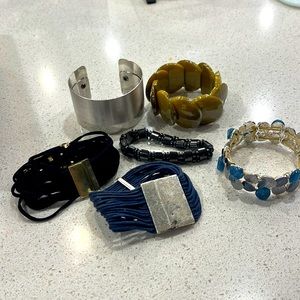 Set of 6 bracelets.  Silver, blue, green, black, gold.  Pretty accessories!